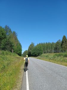 Summer trainee walking away after geological sampling