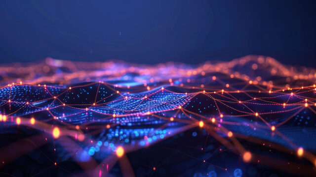 Kuvassa digitaalista, abstraktia esitystä verkosta tai tietomaisemasta. Kuvassa yhdistyy toisiinsa pisteitä ja viivoja, jotka muodostavat verkkomaisen rakenteen, hehkuvat solmut ja kirkkaat värit (sininen, oranssi, punainen). sekä tumman taustan, joka korostaa valaistua verkkoa.