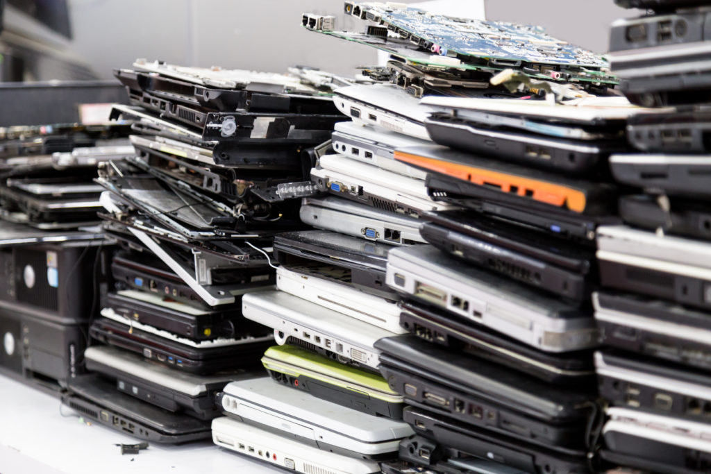 Stack of old, broken and obsolete laptop pc computer for repair and recycle