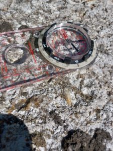 Rock and compass - geological specimen