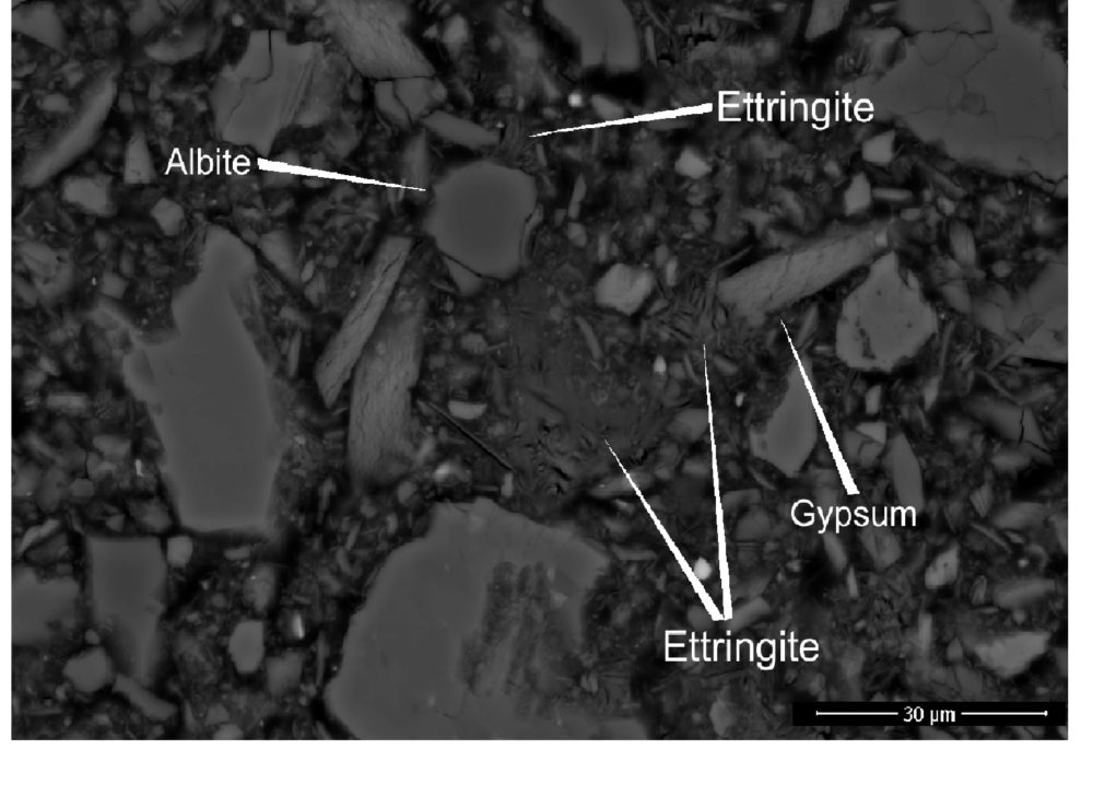 Cemented paste backfill sample with cement binder (R4). Ettringite can be seen filling spaces in the matrix and growing along the boundaries of other minerals such as albite. Figure: Akseli Torppa/GTK.