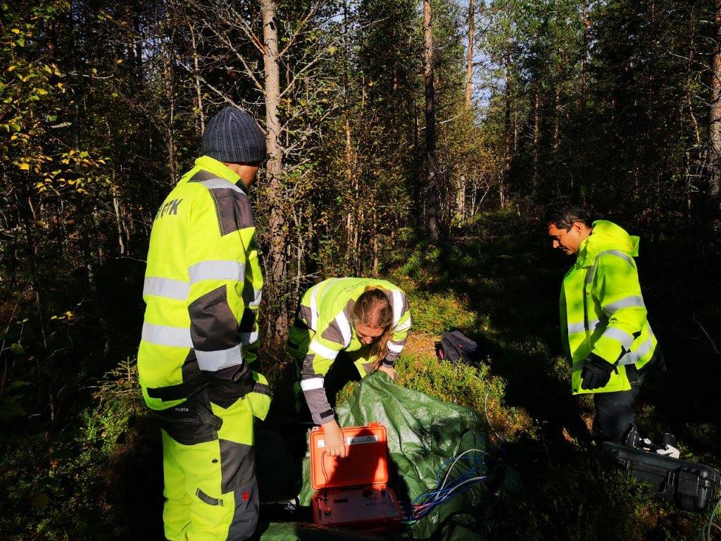 People installing the equipment to the ground.