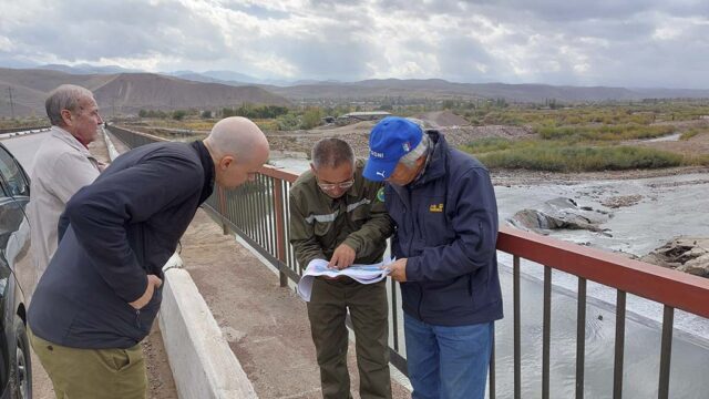 Researchers check the locations of geophysical measurements on the map.